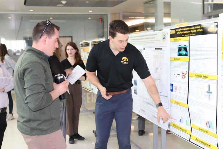 A researcher discusses his poster