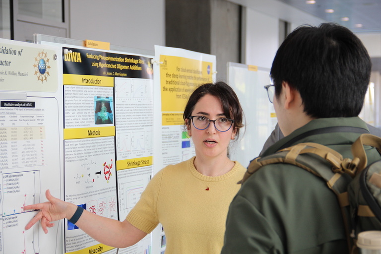 A researcher discusses her poster