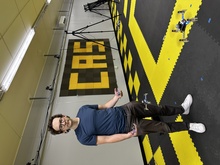 Student poses with drone