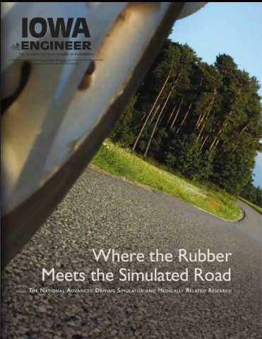 road. cover of magazine that says "where the rubber meets the simulated road". 