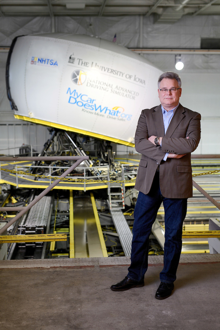 Director Dan McGehee in front of the NADS-1 simulator 