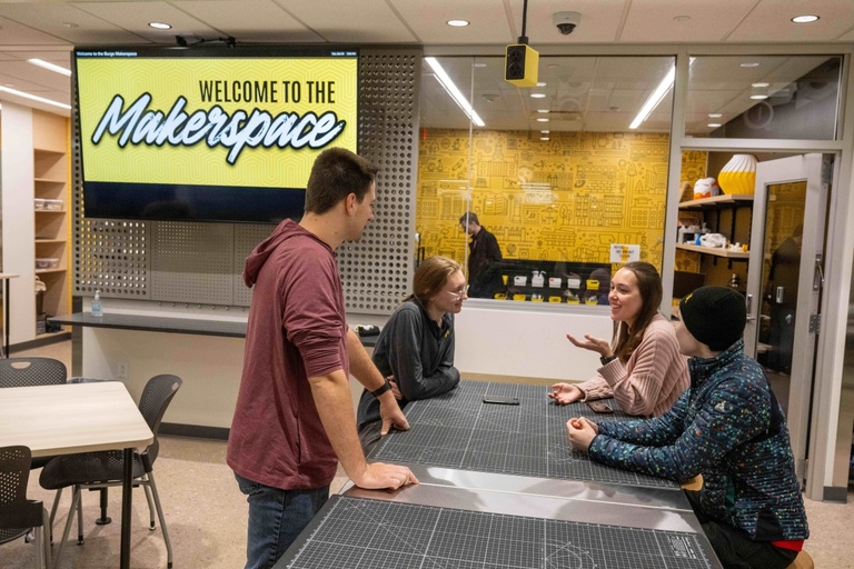 Students talk in the Makerspace