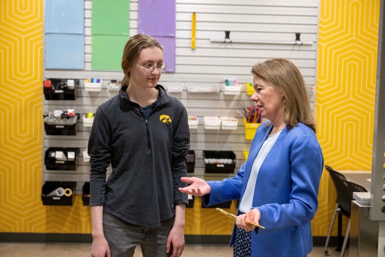 Dean Ann McKenna speaks with a student in the Makerspace