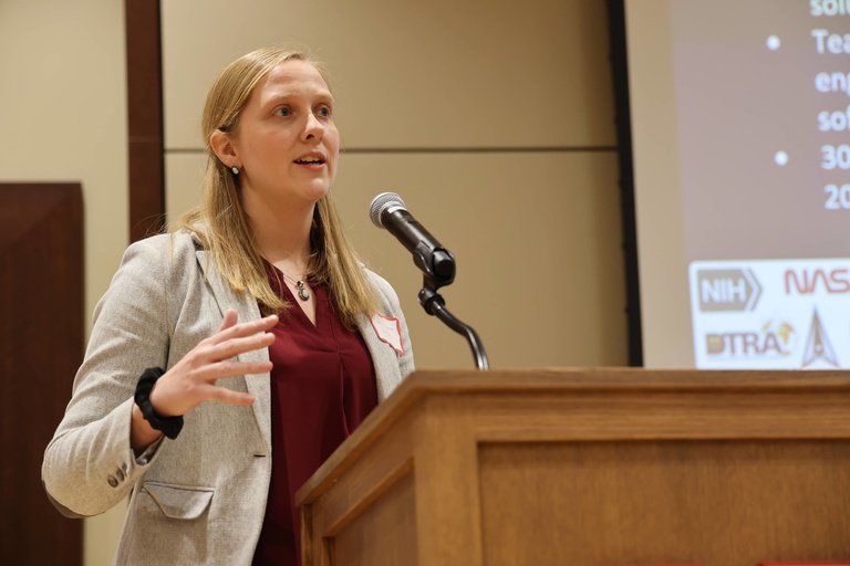 A person presenting at a conference