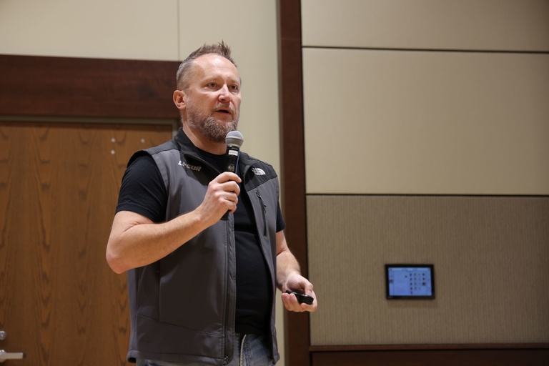 A person presenting at a conference