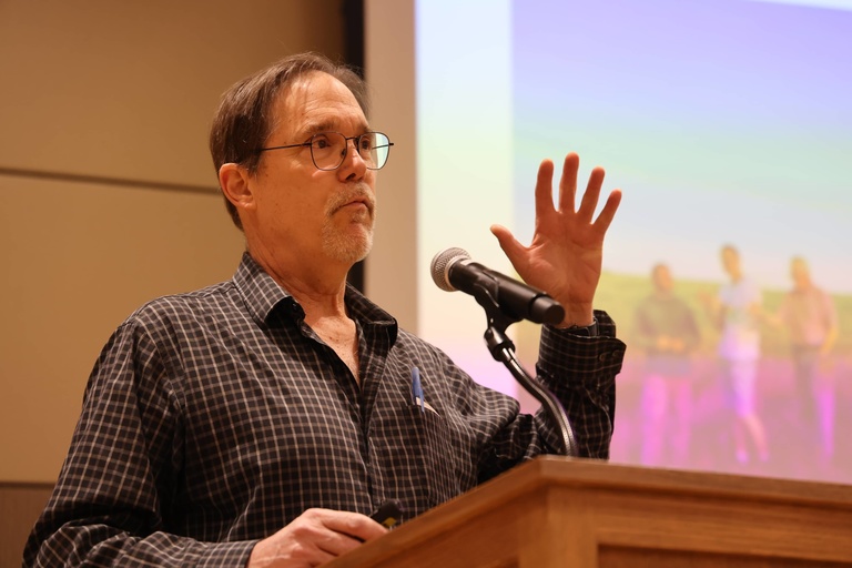 A person presenting at a conference