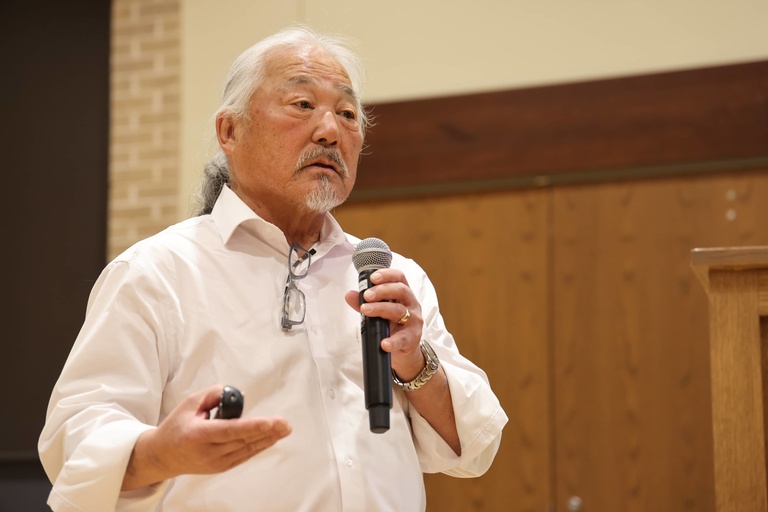 A person presenting at a conference