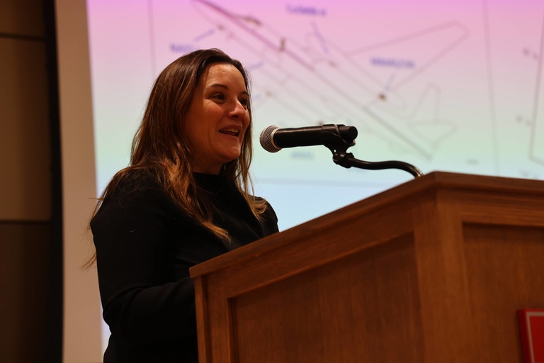 A person presenting at a conference