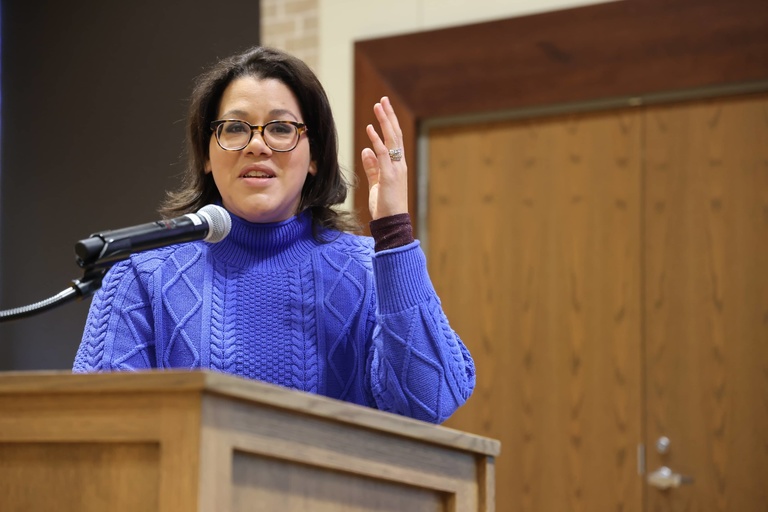 A person presenting at a conference