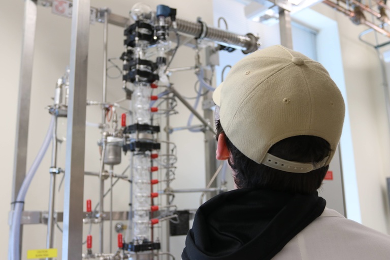 Student looking at new distillation column