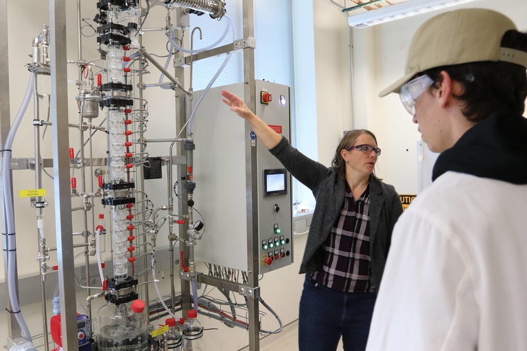 Professor Beth Rundlett with new distillation column