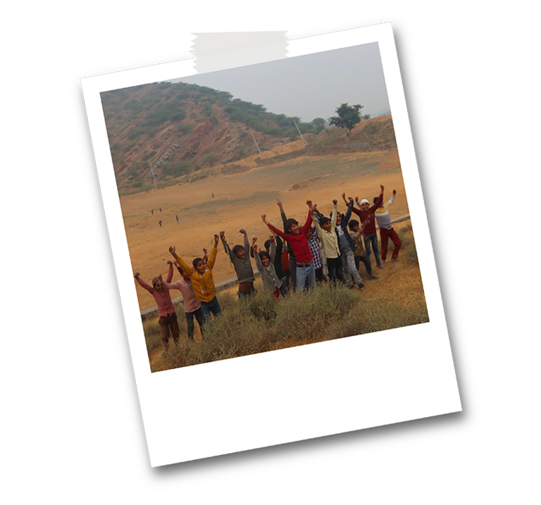 group of local children cheering