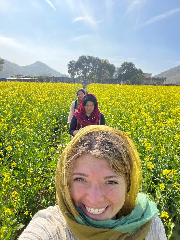 India Winterim student taking selfie in field