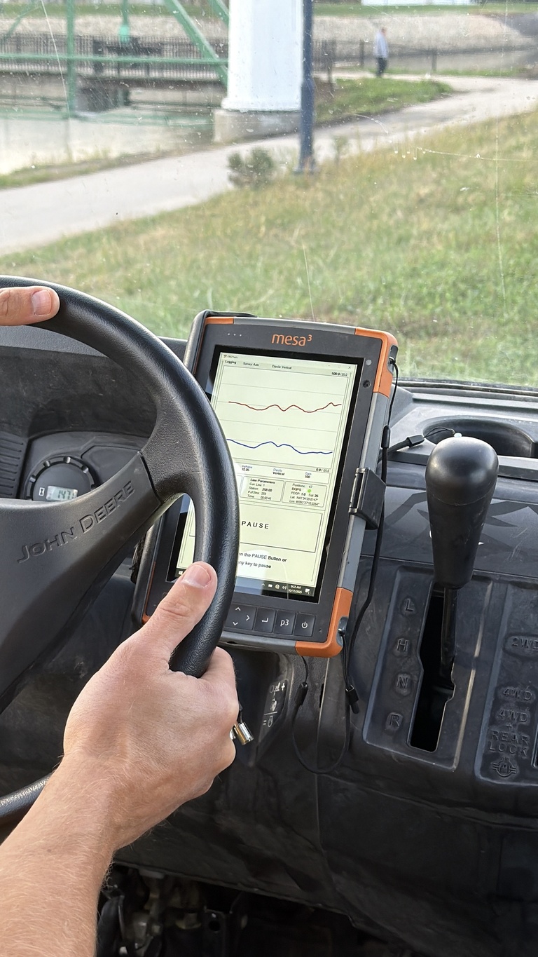 Digital display screen next to steering wheel