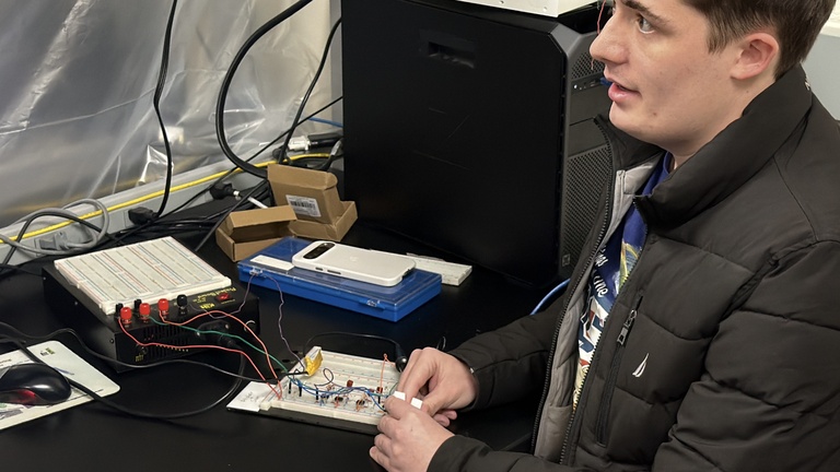 Man inserts fingers into sensor