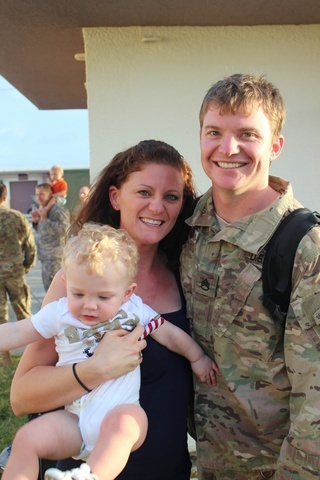 A man and a woman with a small child