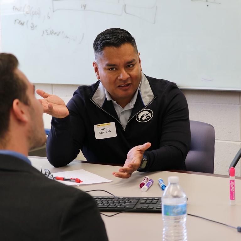 Kevin Meredith speaks with a student