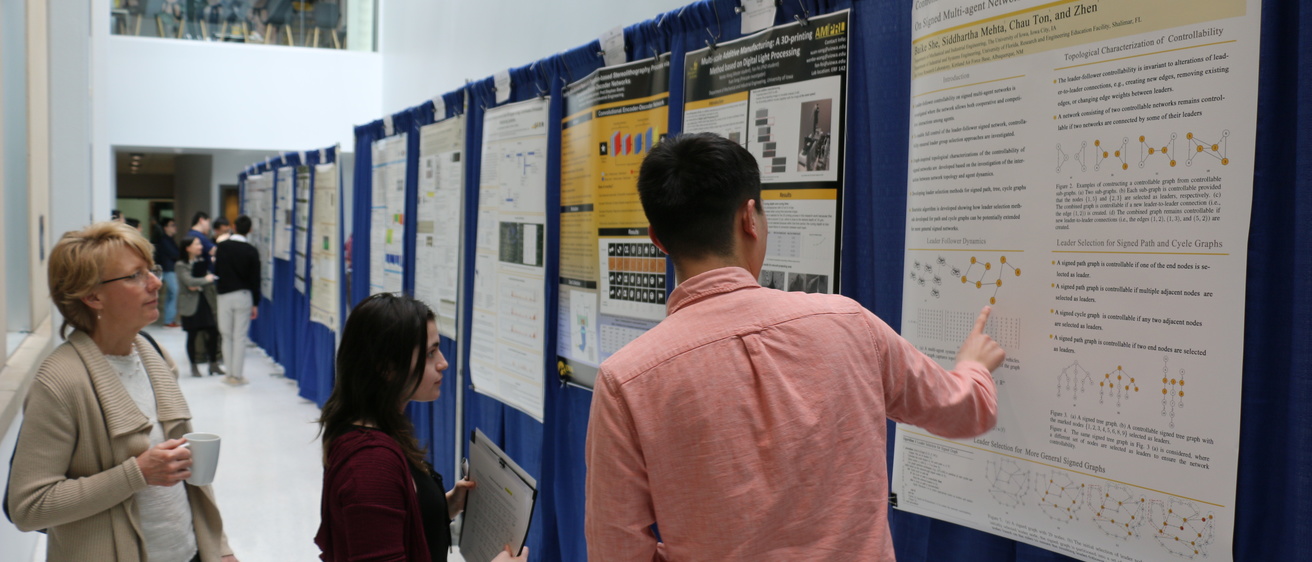 People viewing research posters