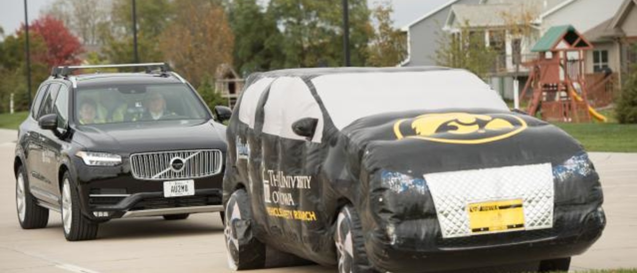 Two black University of Iowa branded vehicles