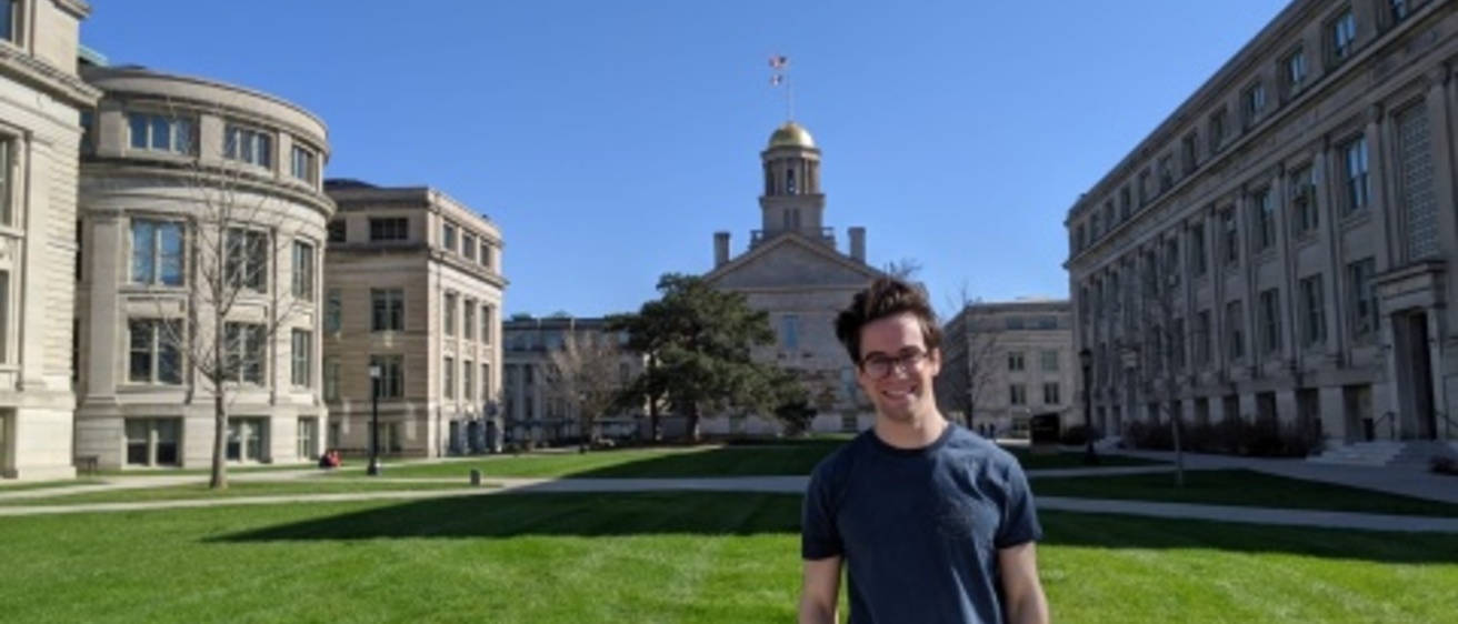 Jonah standing in front of old capitol building 