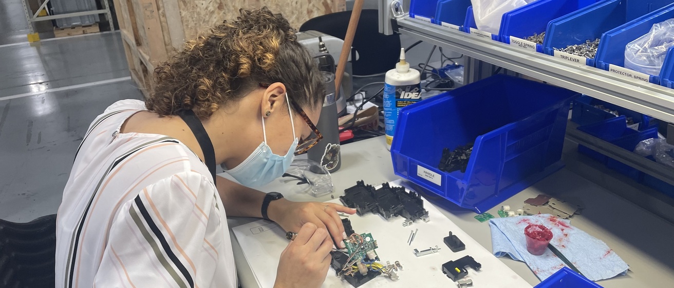 Student repairing a Machine