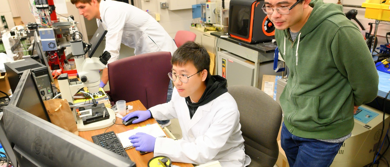 xuan song and student in lab