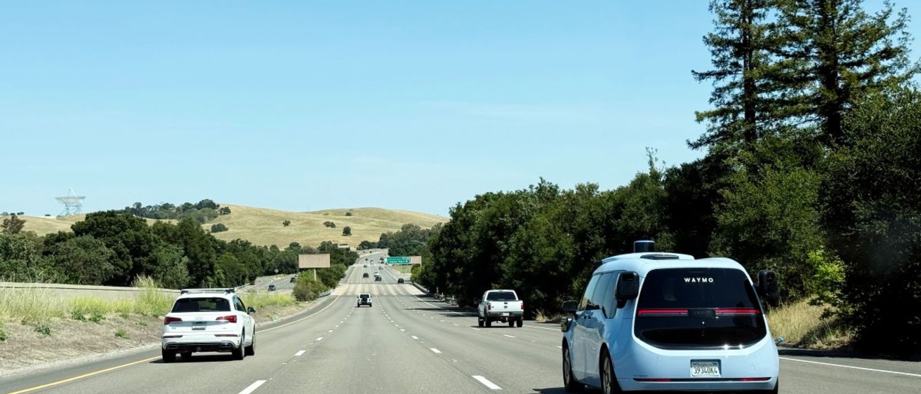 Waymo driverless vehicle on an open highway road