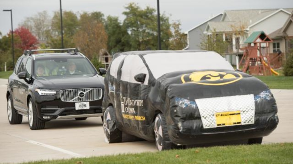 Two black University of Iowa branded vehicles