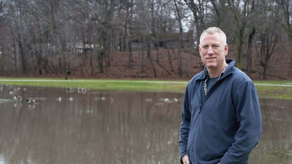 Photo of Keith Schilling standing in front of a body of water