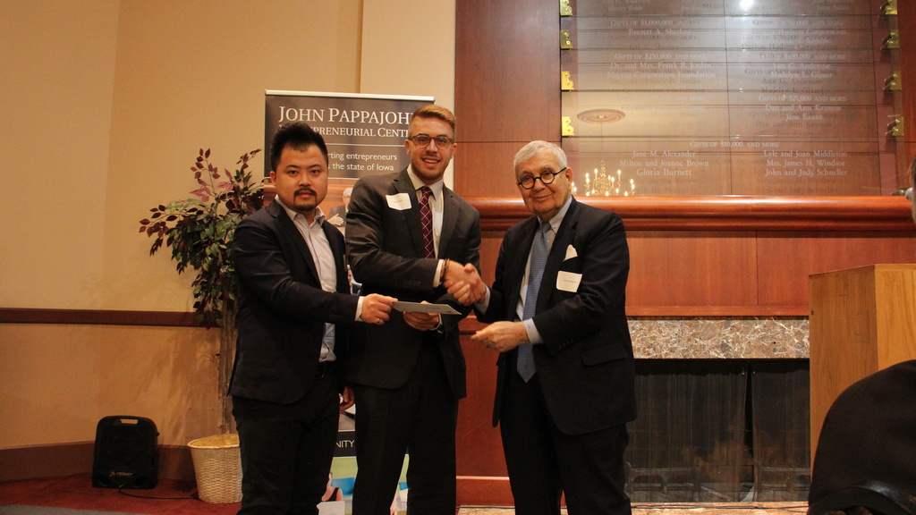 Jaison Marks receiving an award from the Pappajohn Iowa Entrepreneurial Venture Competition