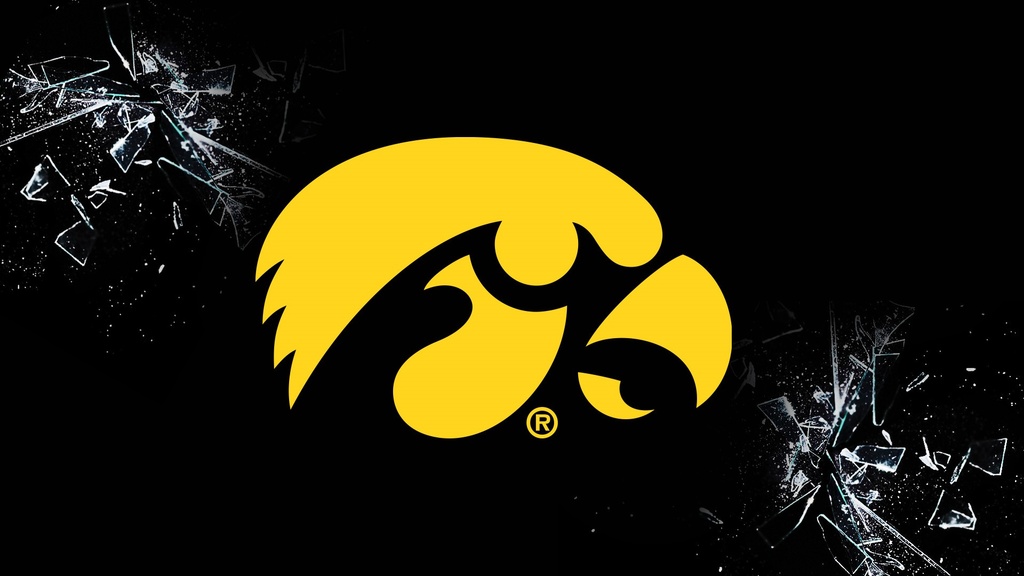 Yellow Iowa Hawkeyes logo laid over an image of breaking glass