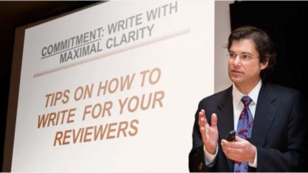 Man presenting a slideshow on how to write for clarity