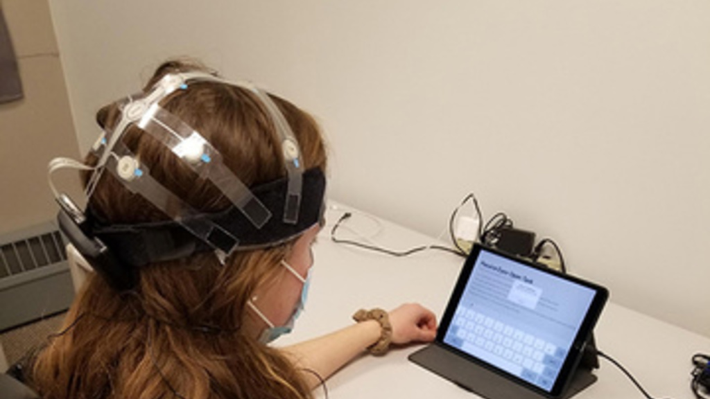 Study subject wearing a mobile, wireless X24 EEG headset (Advanced Brain Monitoring, Carlsbad, CA) and completing the Cannabis Impairment Detection Application (CIDA) on a tablet