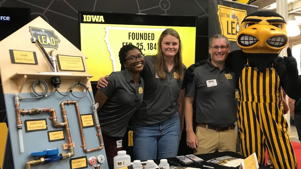 Get the Lead out booth with Dr. Amina Grant (UI alumna and ORISE Fellow at the U.S. Environmental Protection Agency), Danielle Land, and Drew Latta