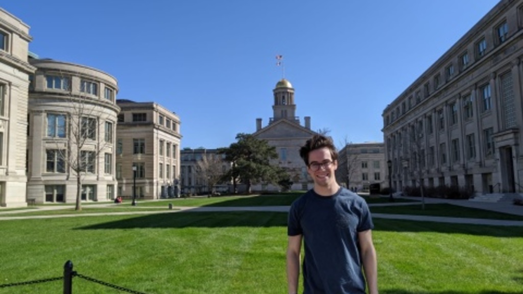 Jonah standing in front of old capitol building 