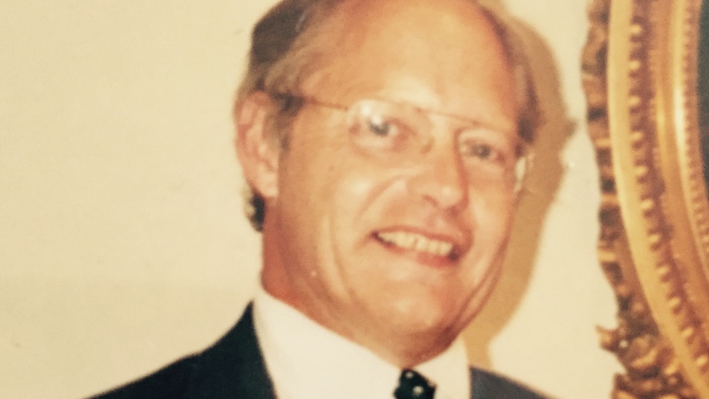 Photo of george ashton wearing tie and glasses