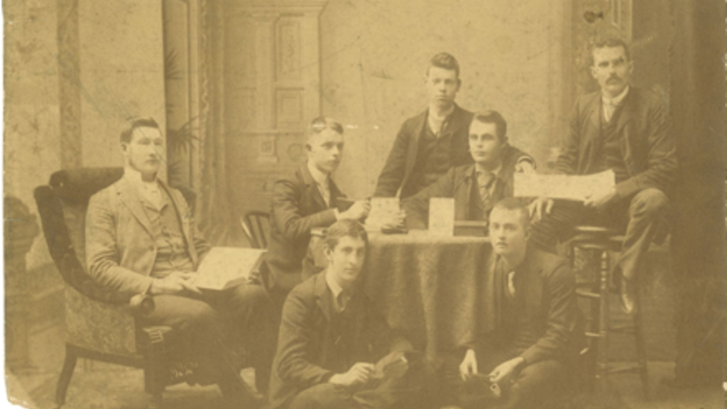 male students on very old photograph
