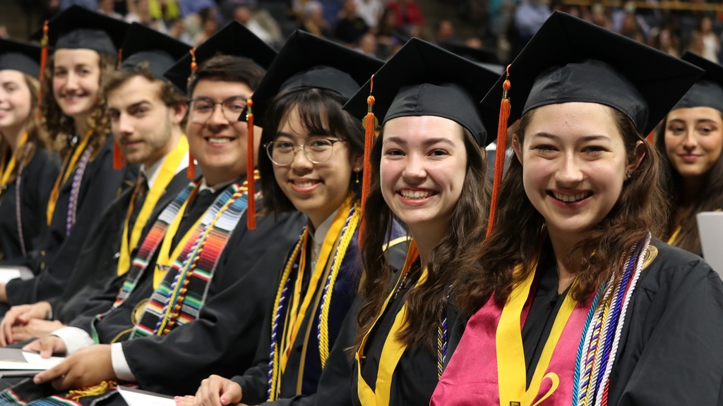Students smile at commencement