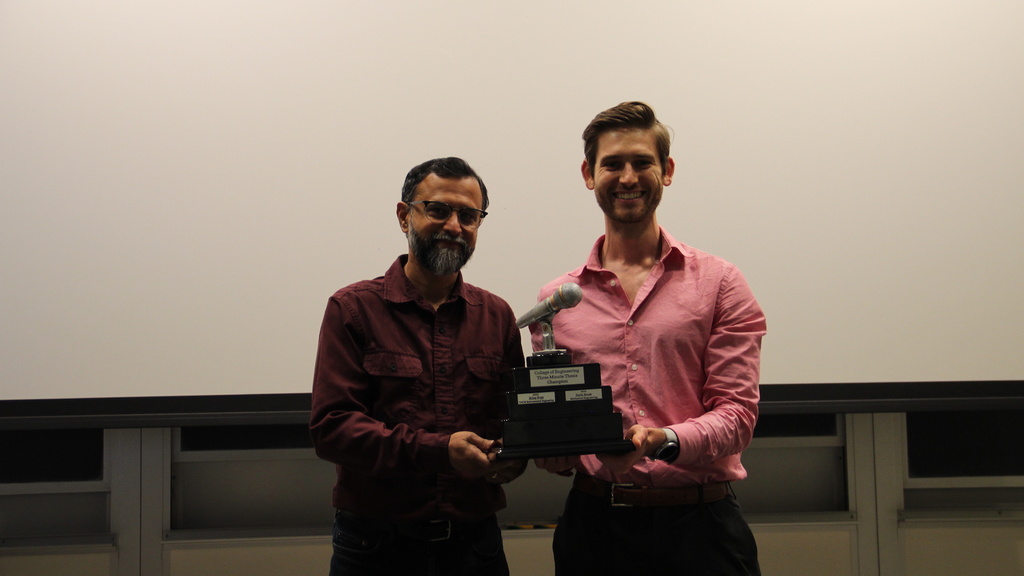 Professor Udaykumar presents a trophy to Chris Vidmar