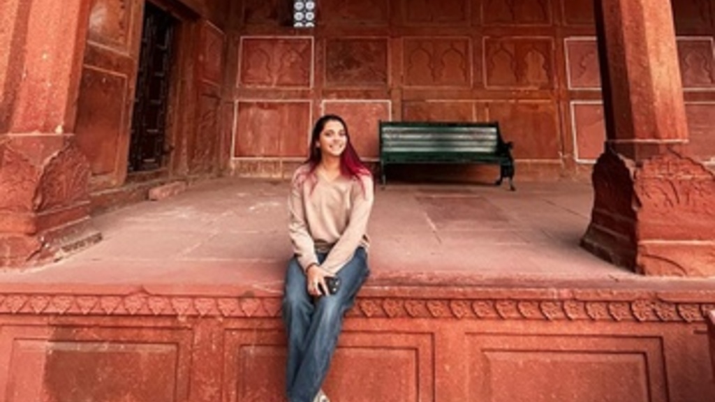 Naina Miranda poses for a photo on a veranda in India