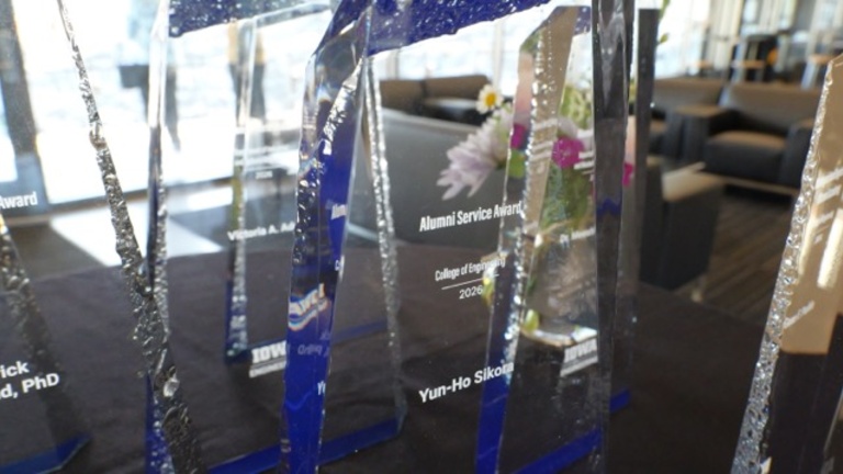 Glass trophies on table with black table cloth